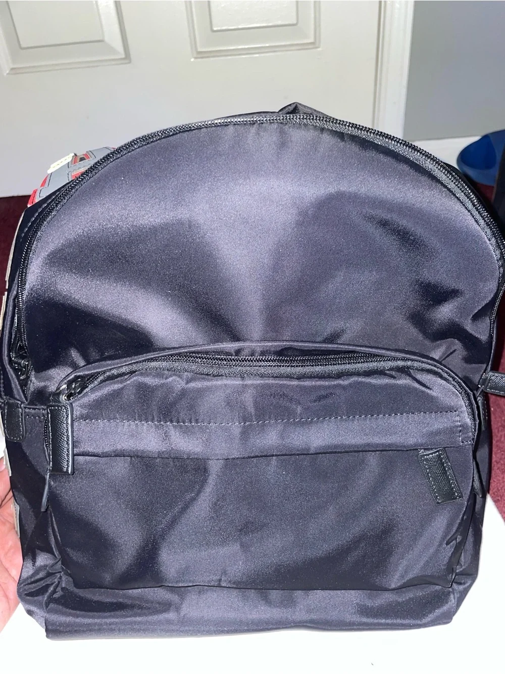 Prada Men’s Black Nylon Backpack with Multicolor Letter Patches
